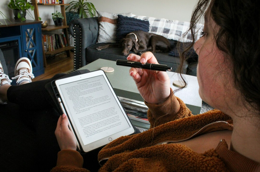 woman using drawing app on tablet