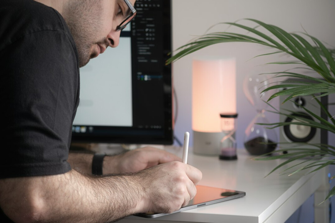 artist drawing on digital tablet