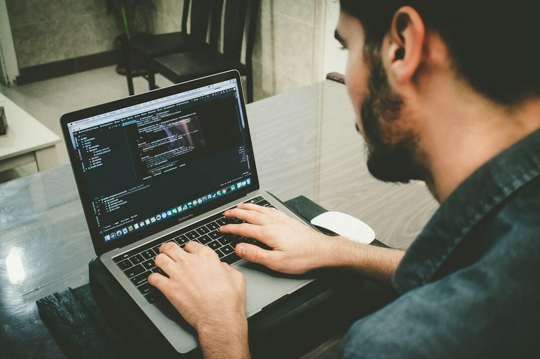 person working on laptop with productivity apps