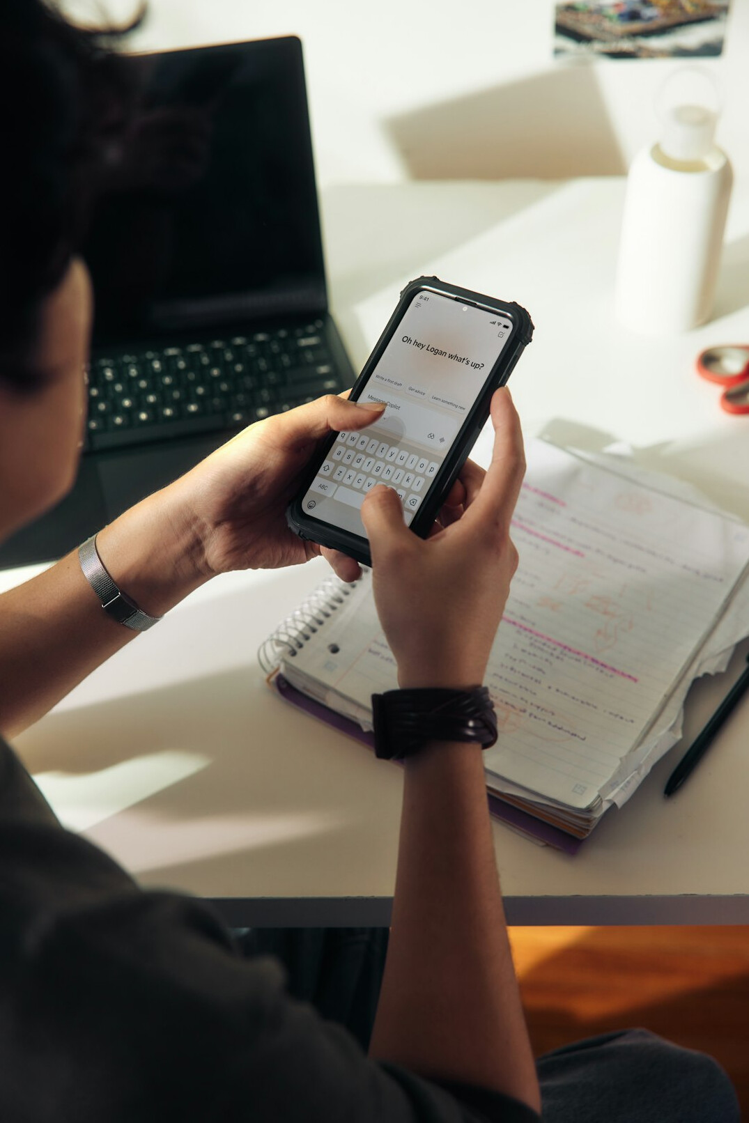 person reviewing notes on phone
