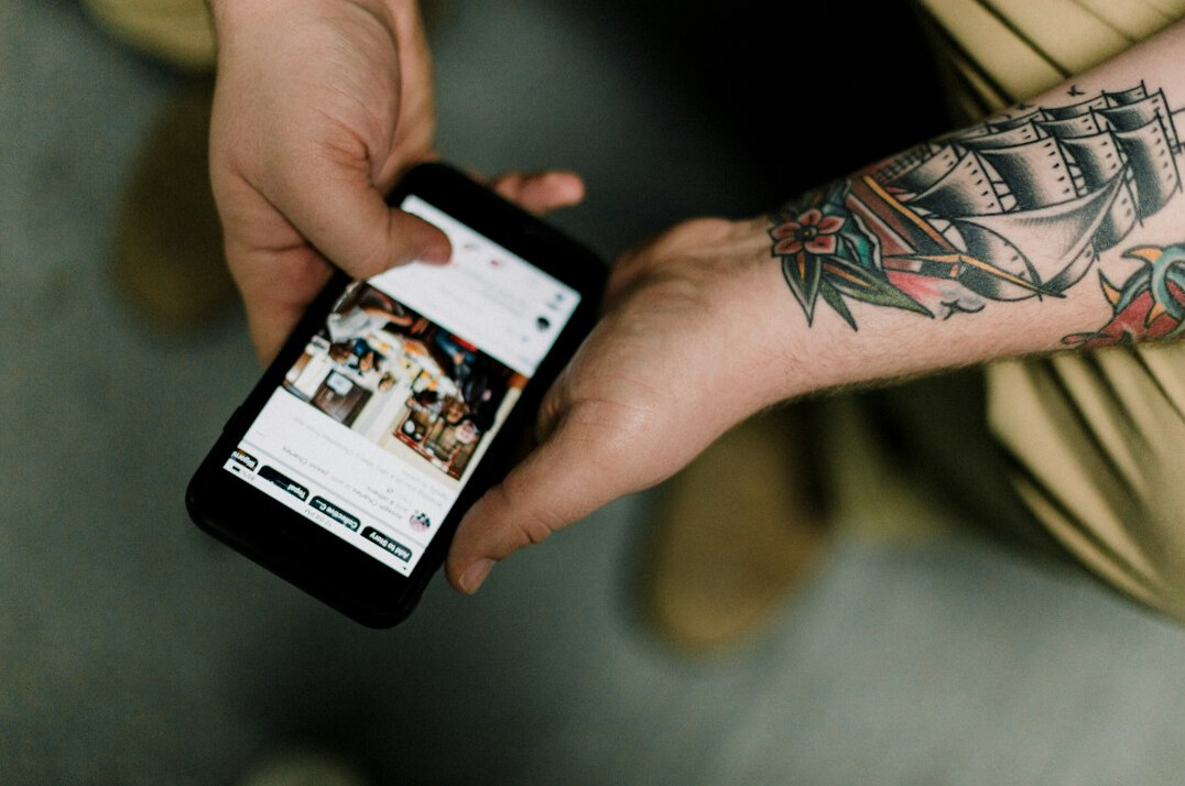 person scrolling phone apps